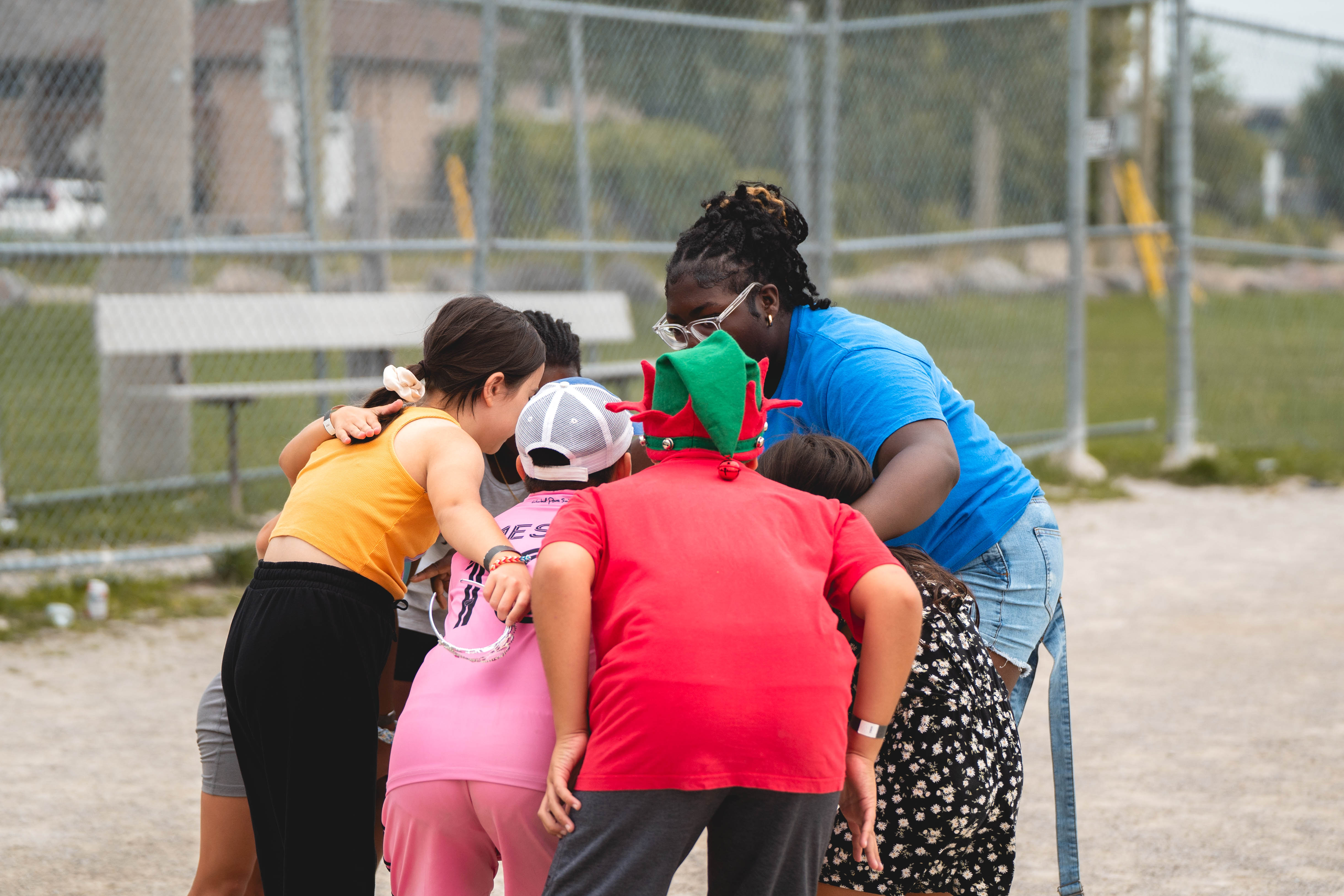 group of campers huddling in a circle