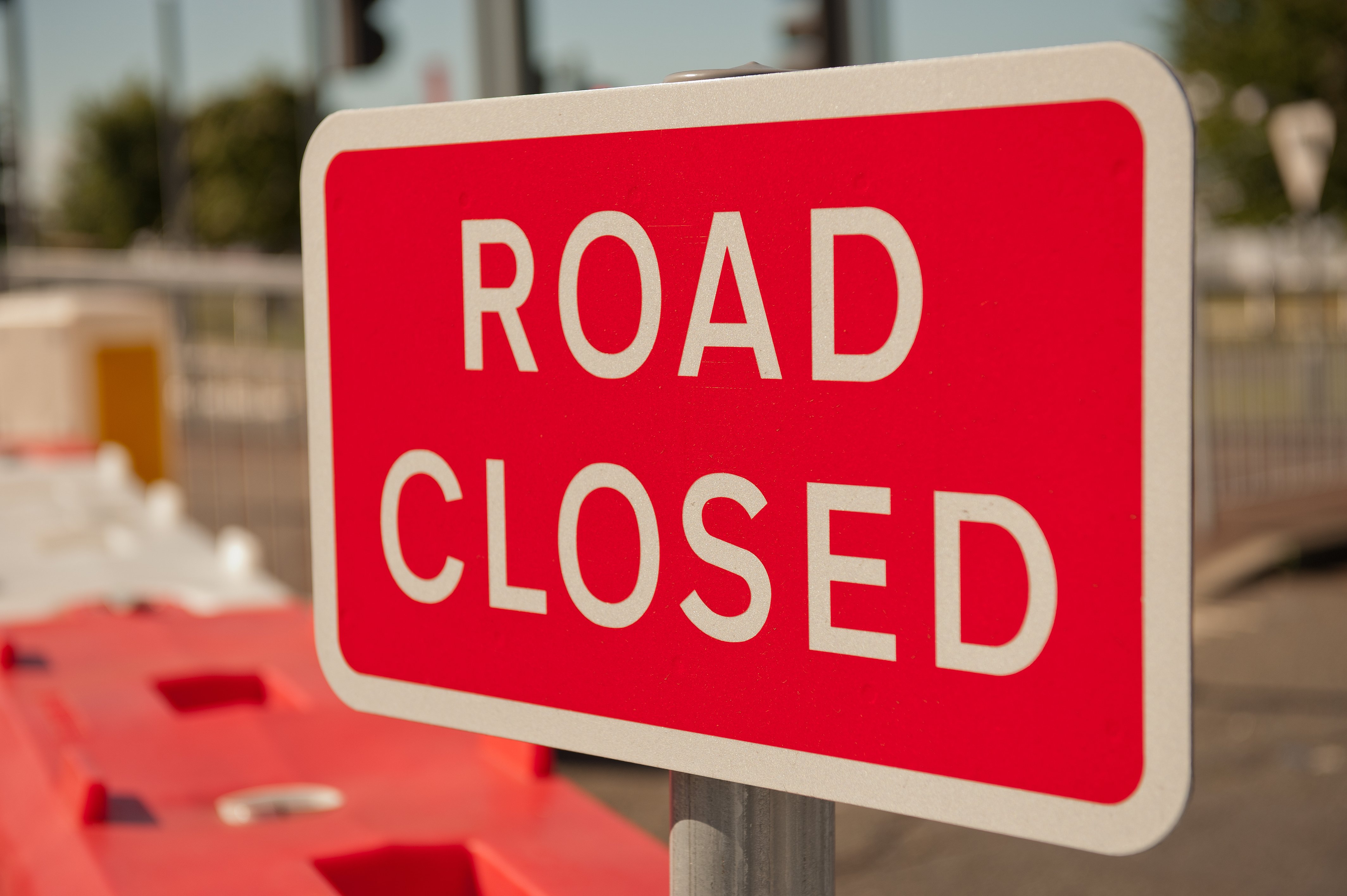 Image of road closed sign on a closed road